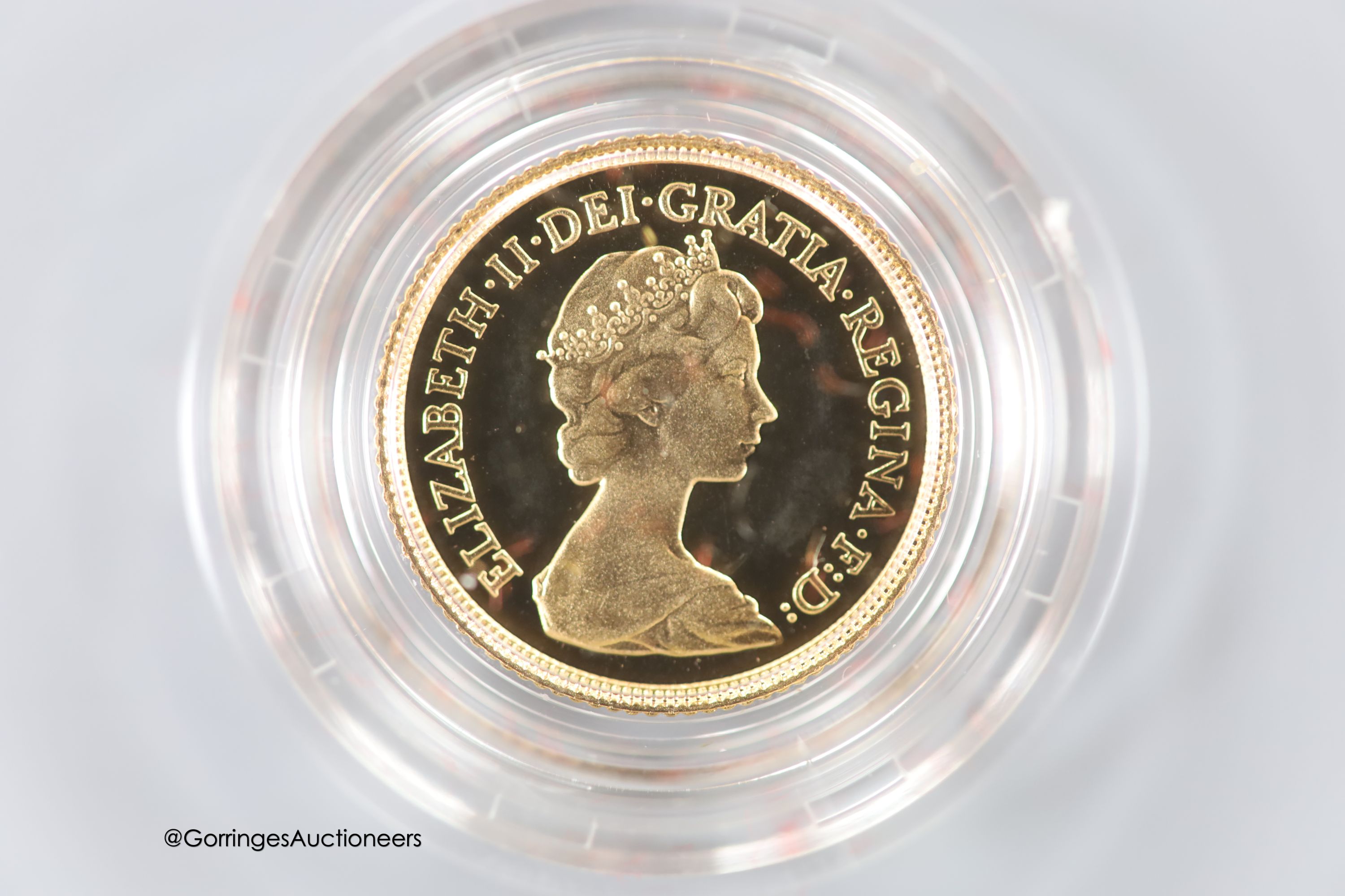 A cased 1980 gold proof half sovereign.
